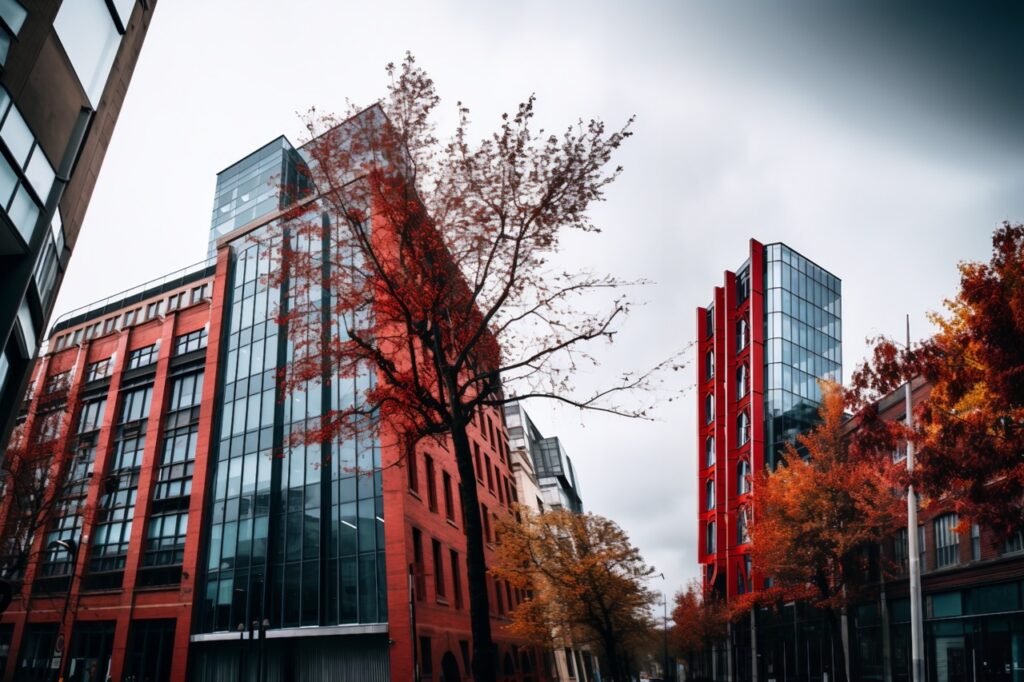 Captivating red edifice with tree in front – Get this impressive urban architectural image for your projects