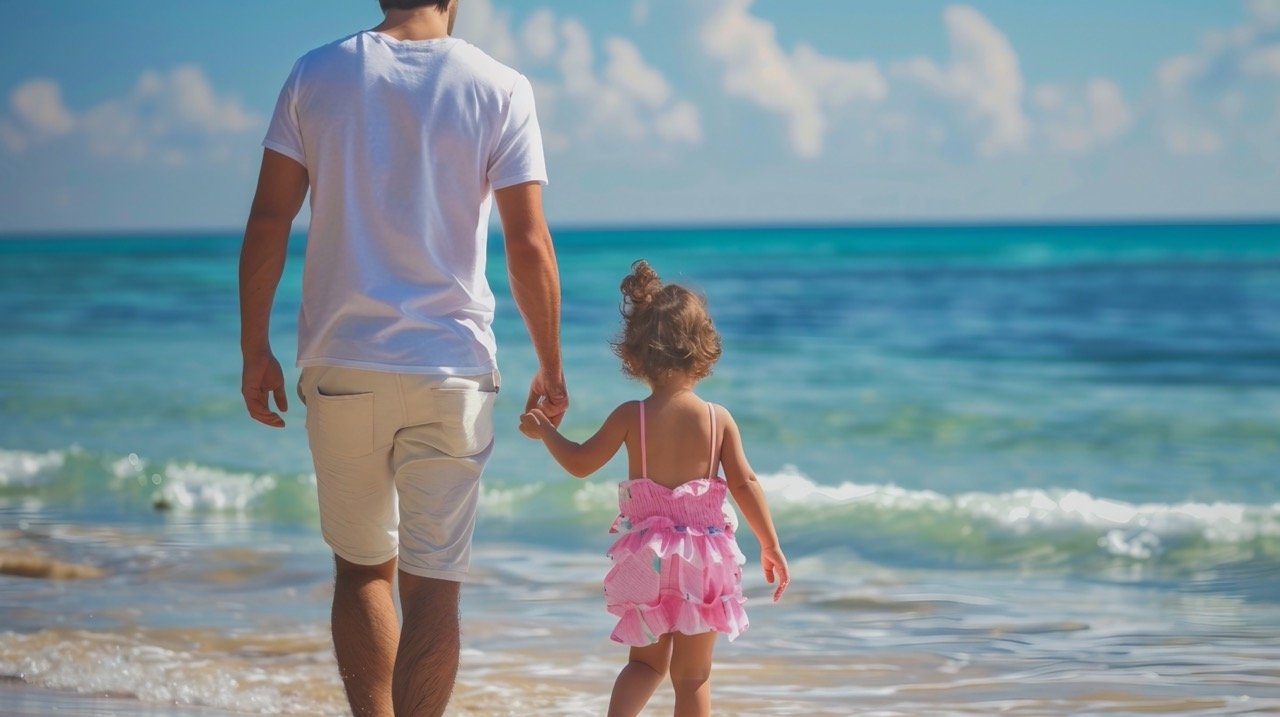 Father and Daughter Walking Towards the Sea – Joyful Stock Image of Family Moments