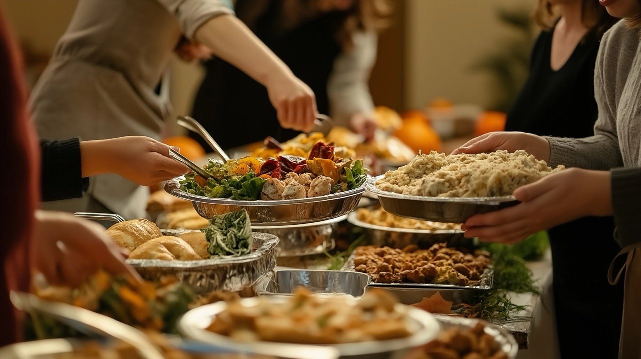 Group of People Serving Food at Thanksgiving Dinner with Festive Table and Traditional Holiday Dishes