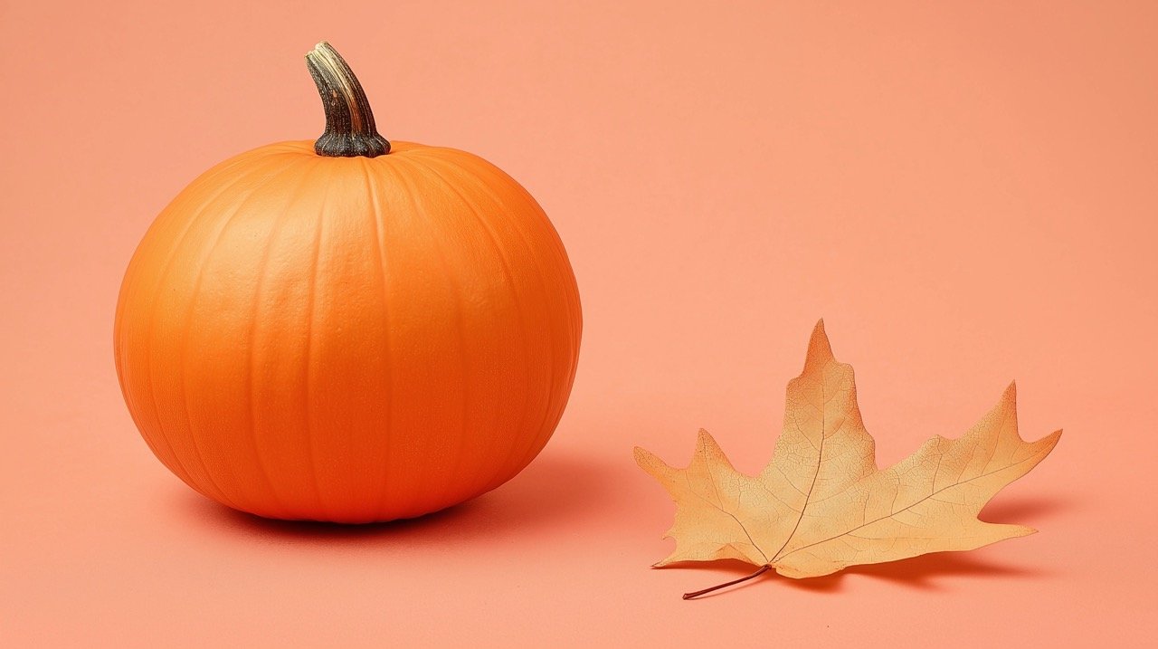 Orange Squash and Dried Brown Leaf Rustic Fall Aesthetic with Small Pumpkin on Wooden Table