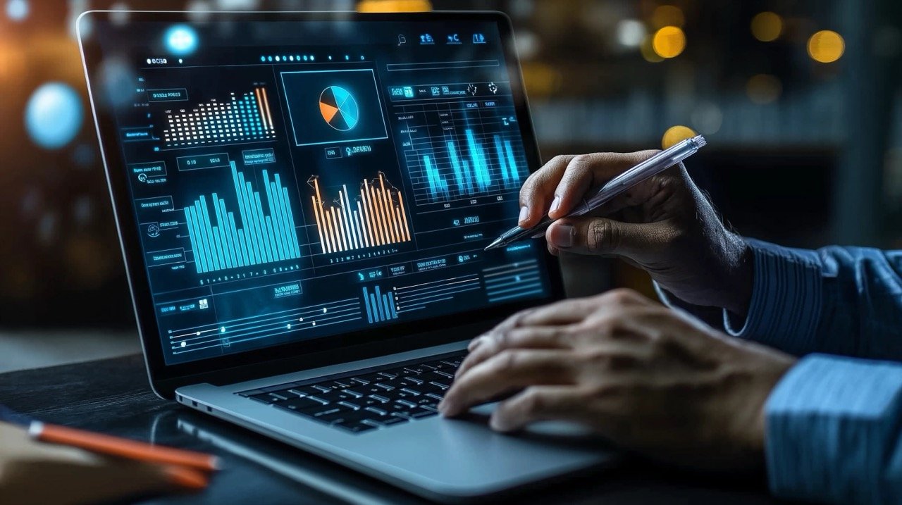 Businessman Working on Laptop Displaying Business Analytics Dashboard with Key Metrics, KPIs, and Insight Reports