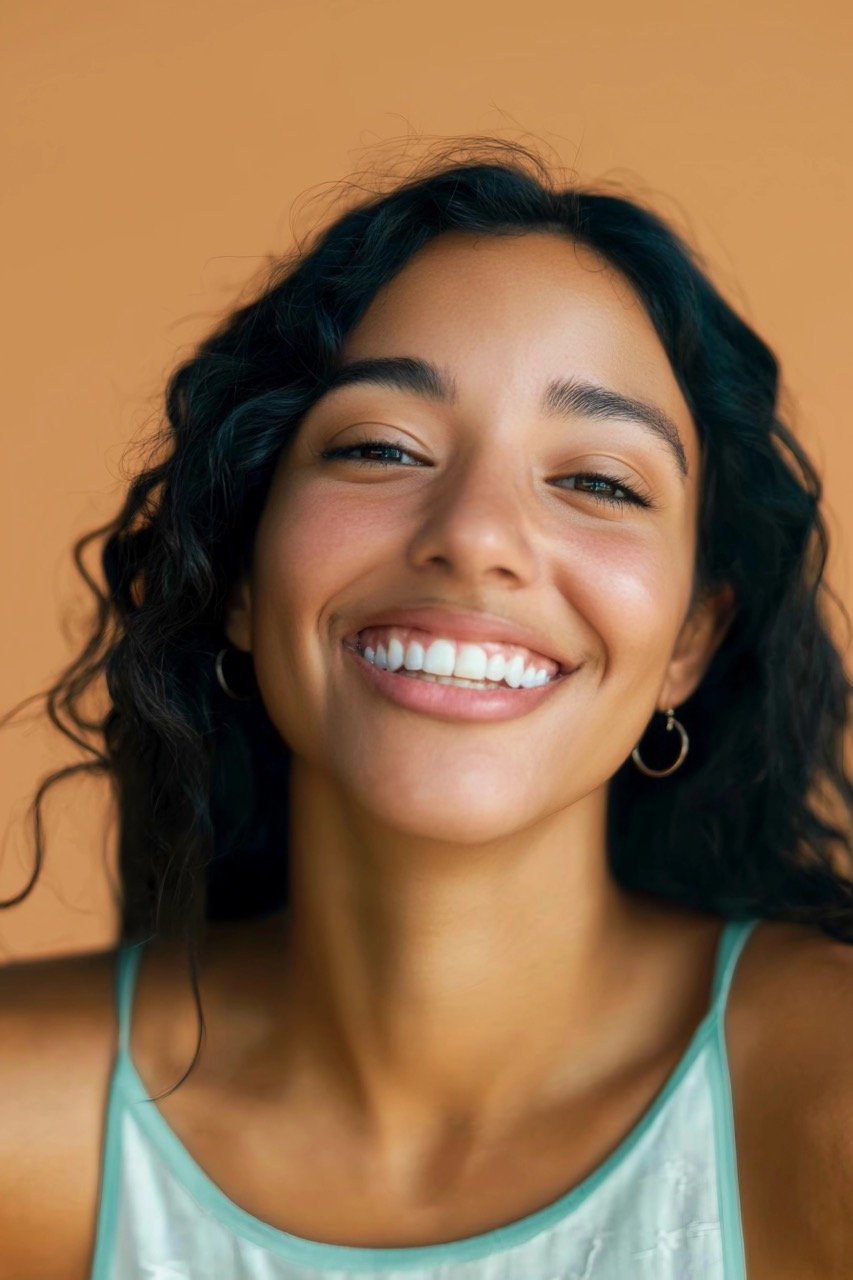 Studio Beauty Portrait of a Gorgeous Hispanic Woman with Diastema and Radiant Skin for Natural Elegance