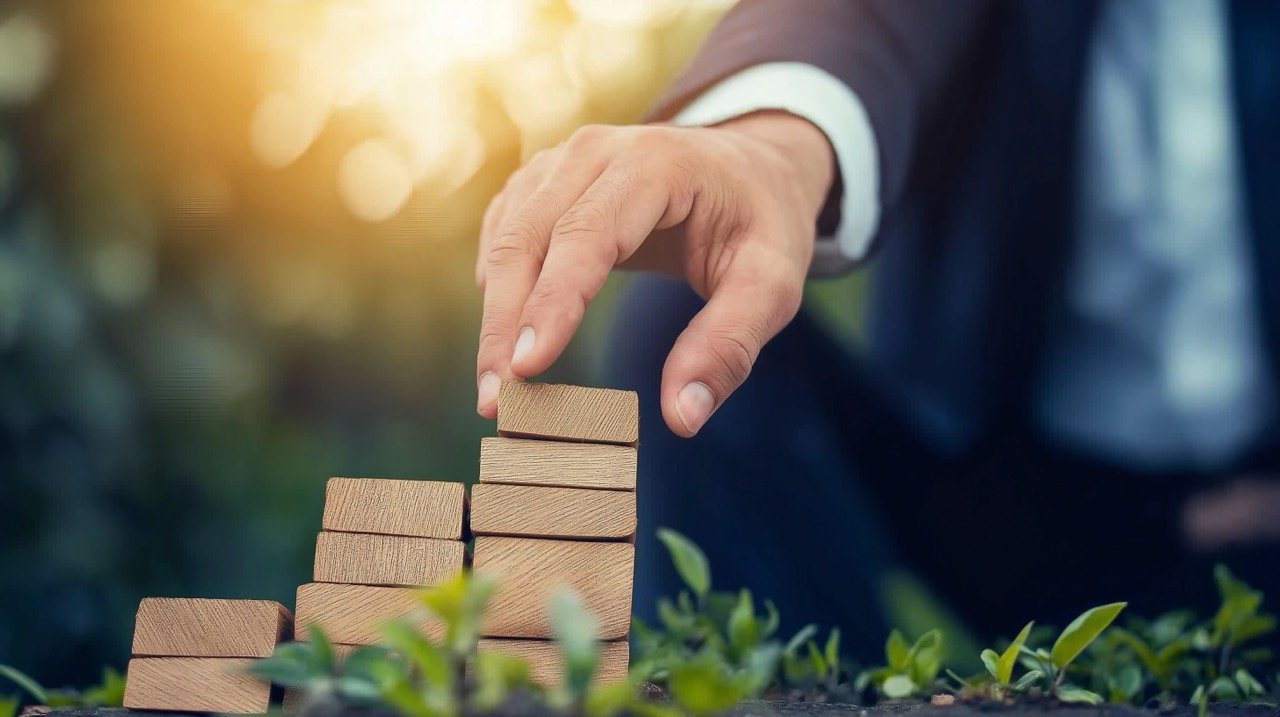 Success Concept Businessman Using Fingers to Climb, Symbolizing Achievement, Growth, and Financial Assistance in Banking.